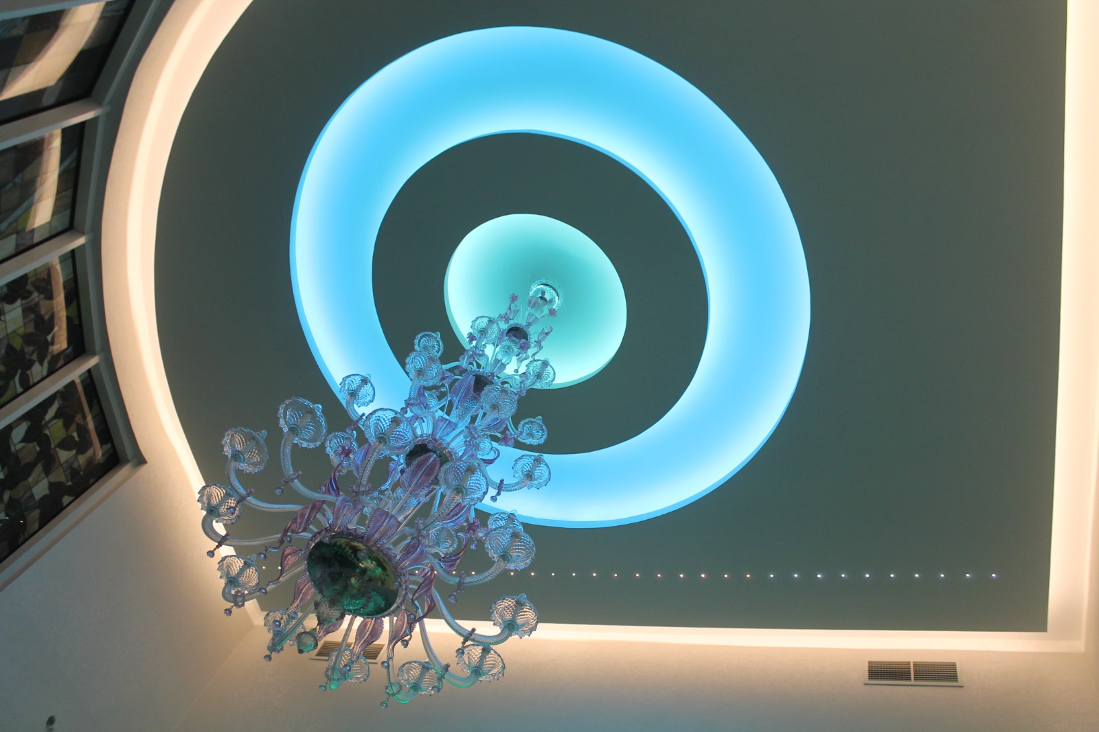 Illuminated ceiling detail with chandelier